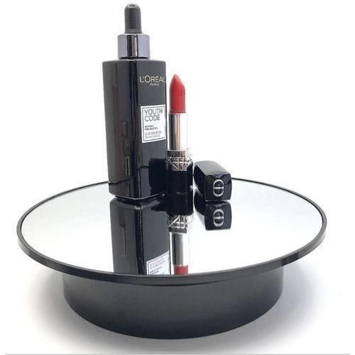Battery-operated, mirrored, rotating display stand.